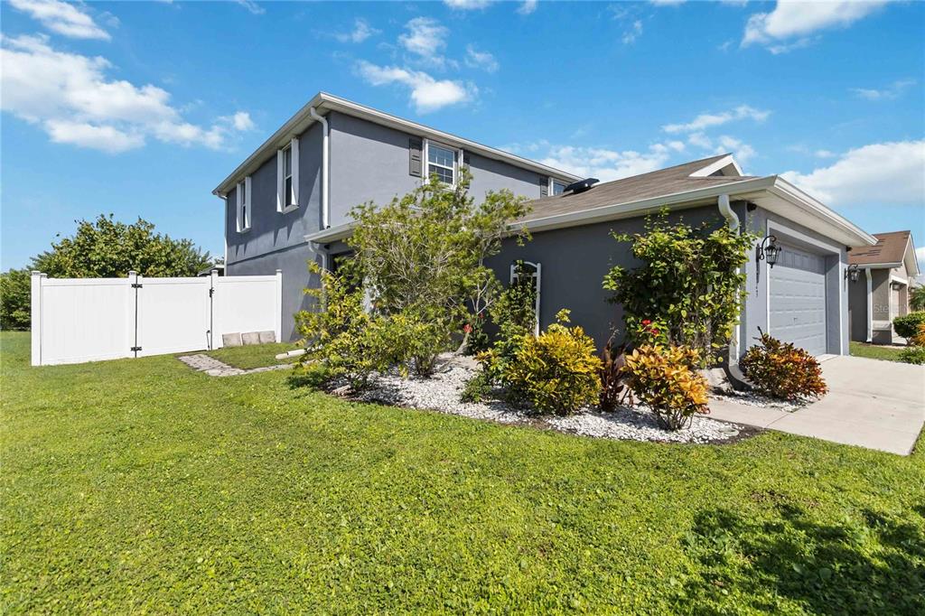 3723 Ricky Lane St. Cloud, FL 34772 - Photo 3 of 36 a front view of a house with a yard