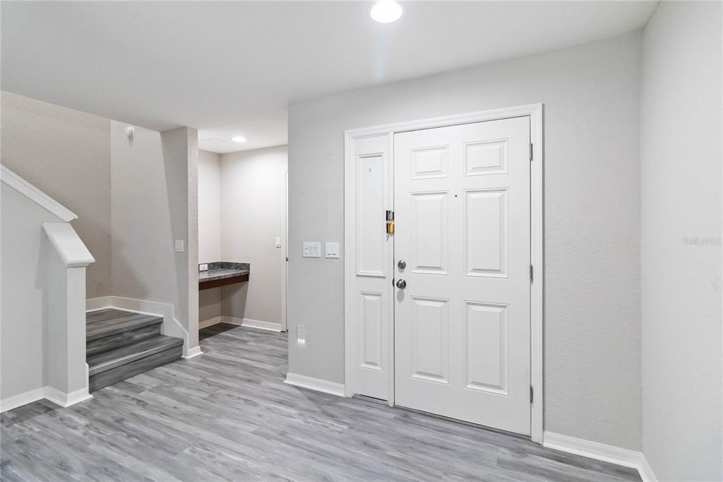 3723 Ricky Lane St. Cloud, FL 34772 - Photo 4 of 36 a view of a room with wooden floor and electronic appliances