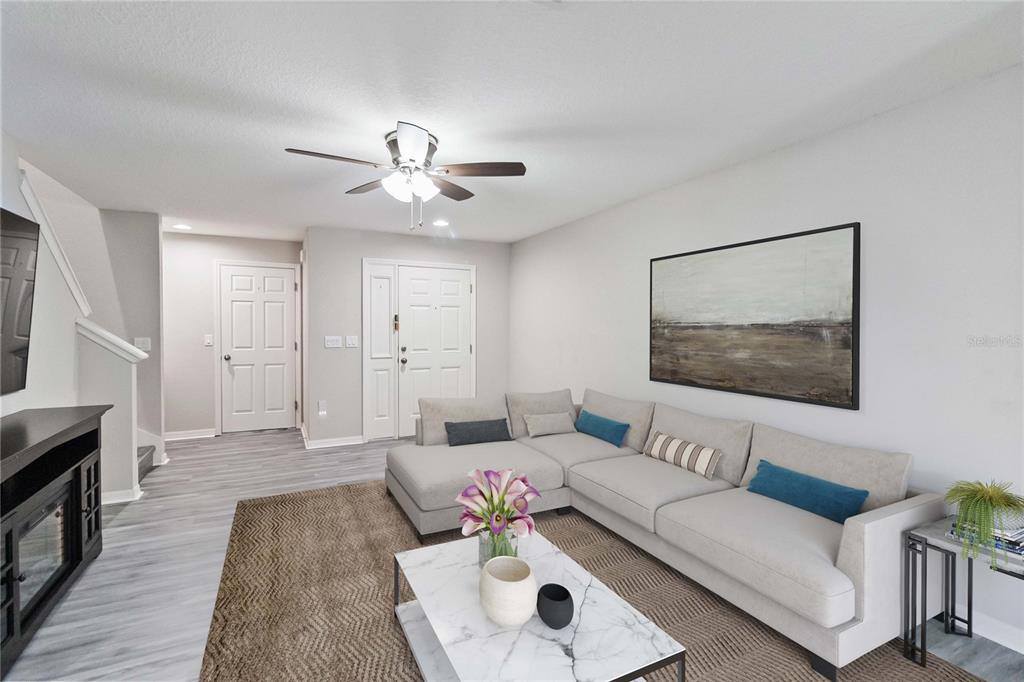 3723 Ricky Lane St. Cloud, FL 34772 - Photo 6 of 36 a living room with furniture and a fireplace