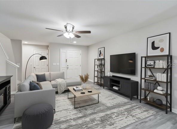 3723 Ricky Lane St. Cloud, FL 34772 - Photo 8 of 36 a living room with furniture and a flat screen tv