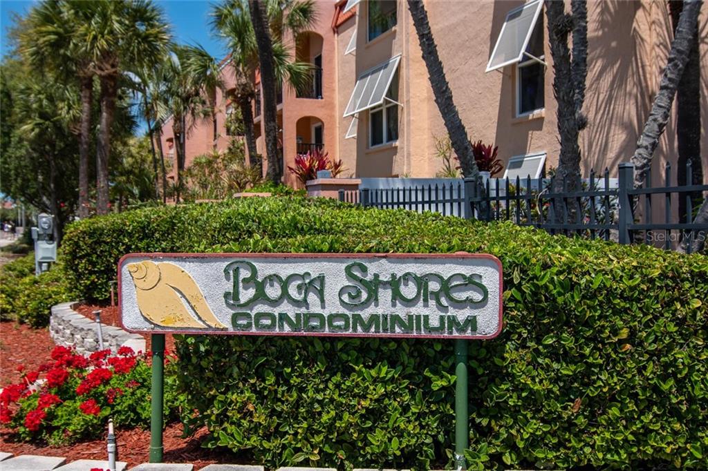 8921 Blind Pass Road, Unit 250 St. Pete Beach, FL 33706 - Photo 1 of 1 a sign on the side of a building