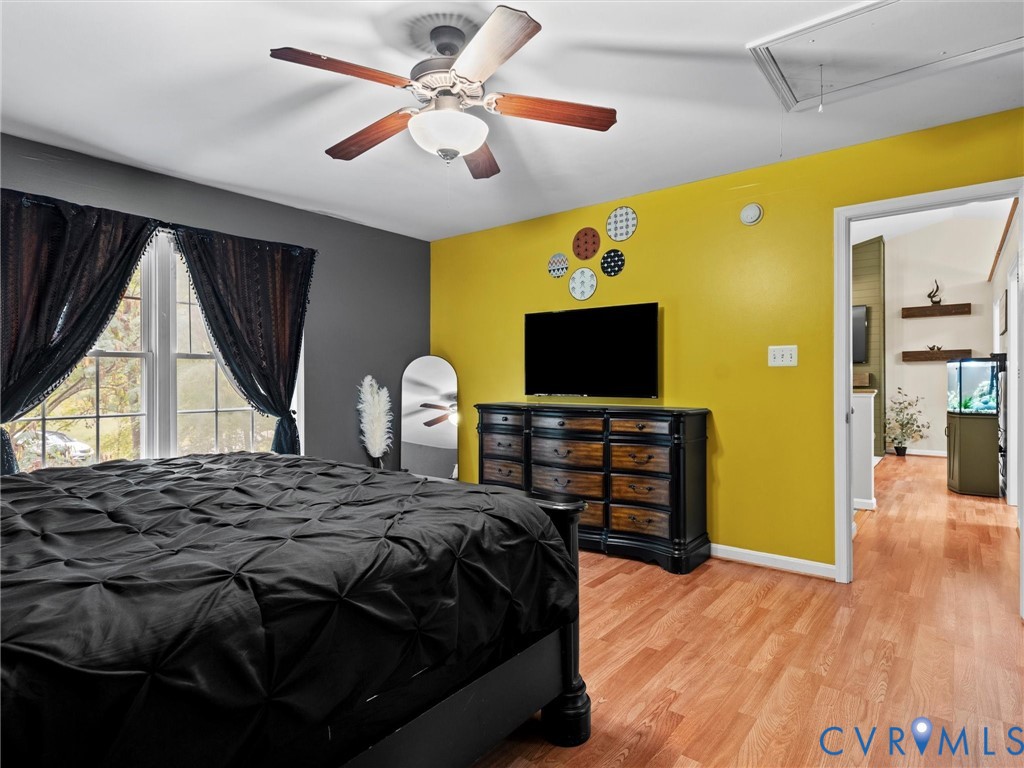 26315 Hill Road Ruther Glen, VA 22546 - Photo 21 of 47 Bedroom featuring attic access, light wood finishe