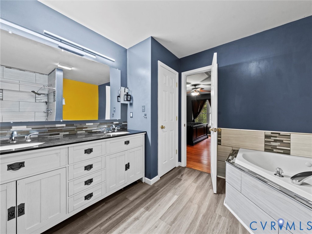26315 Hill Road Ruther Glen, VA 22546 - Photo 29 of 47 Bathroom with double vanity, light wood finished f