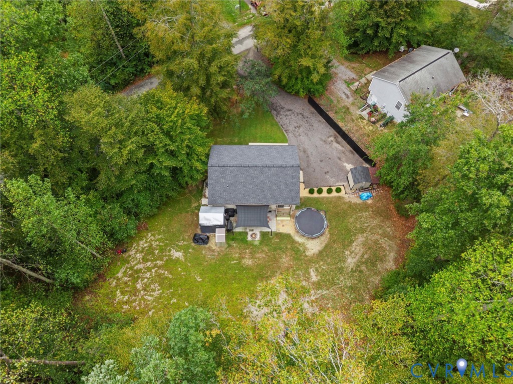 26315 Hill Road Ruther Glen, VA 22546 - Photo 3 of 47 View of subject property with a tree filled landsc