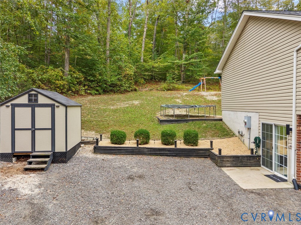 26315 Hill Road Ruther Glen, VA 22546 - Photo 46 of 47 View of yard with a storage unit