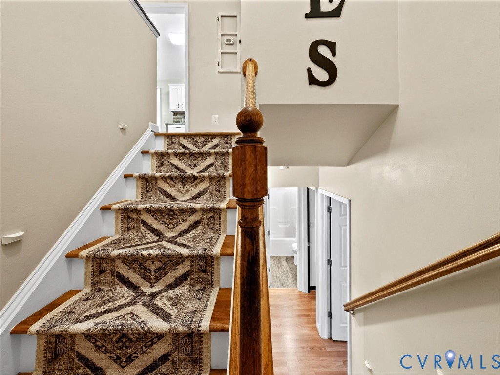 26315 Hill Road Ruther Glen, VA 22546 - Photo 8 of 47 Stairway featuring wood finished floors and basebo