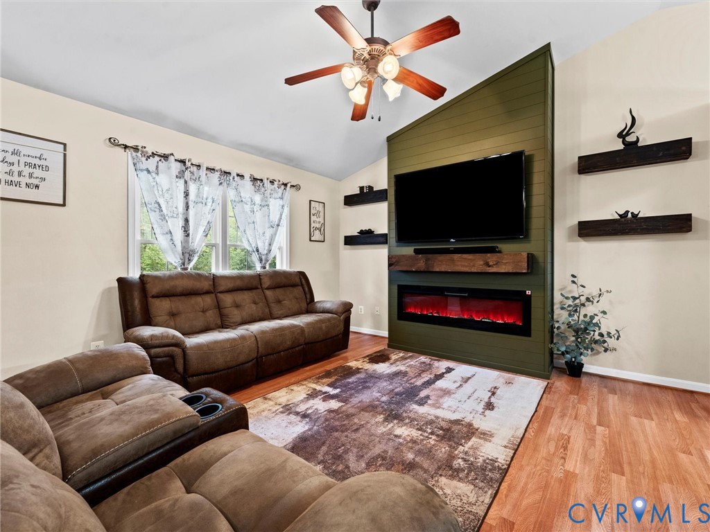 26315 Hill Road Ruther Glen, VA 22546 - Photo 10 of 47 Living area with light wood-style floors, vaulted