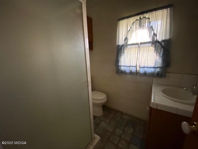 4999 Sandy Run Road Sparta, GA 31087 - Photo 18 of 19 a bathroom with a toilet sink and window