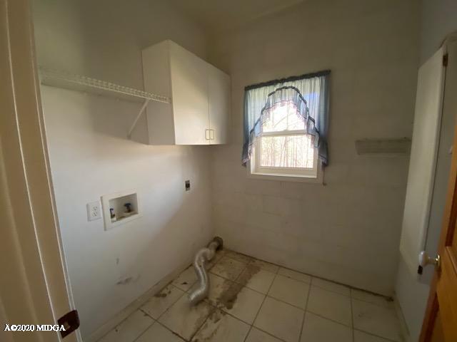 4999 Sandy Run Road Sparta, GA 31087 - Photo 19 of 19 a bathroom with a window and a shower