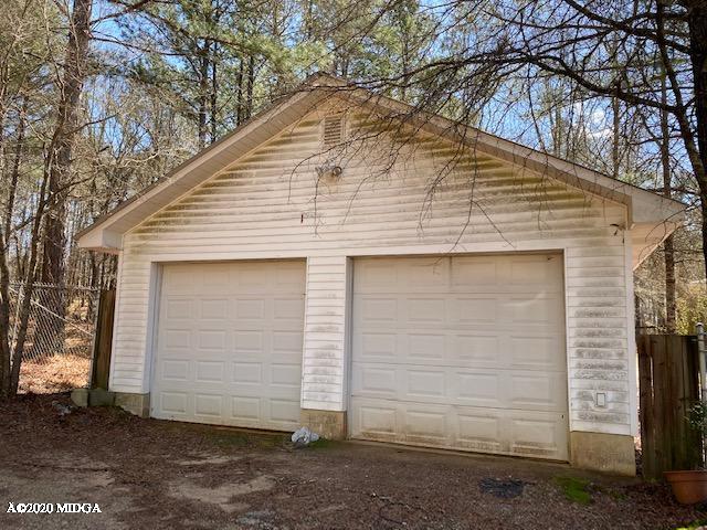 4999 Sandy Run Road Sparta, GA 31087 - Photo 3 of 19 a view of a white house with a large tree