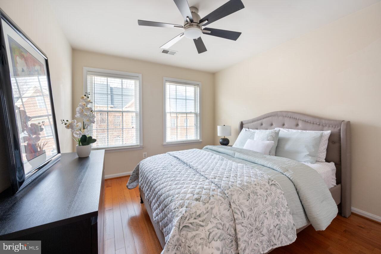 47799 Scotsborough Square Sterling, VA 20165 - Photo 32 of 53 a bedroom with a large bed and a large window