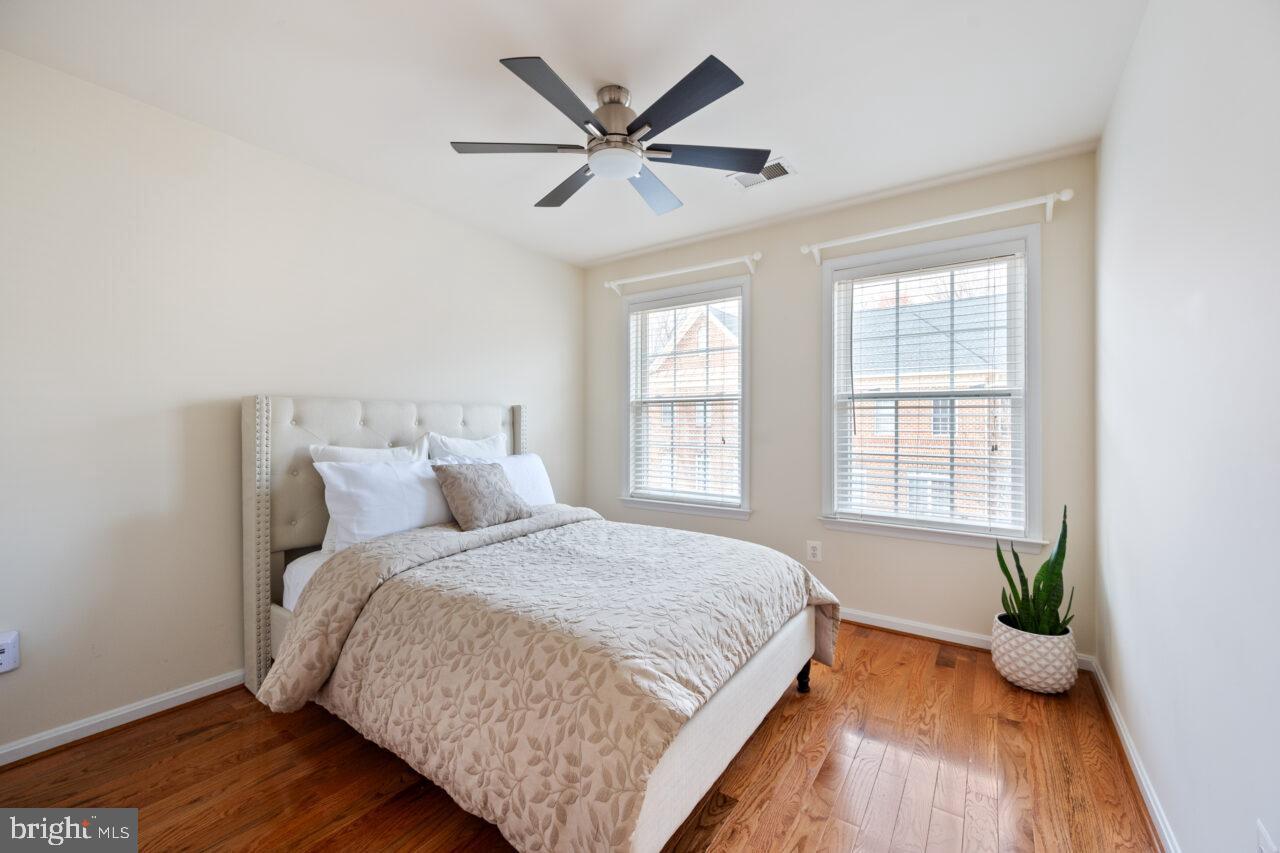 47799 Scotsborough Square Sterling, VA 20165 - Photo 33 of 53 a bedroom with a bed and wooden floor