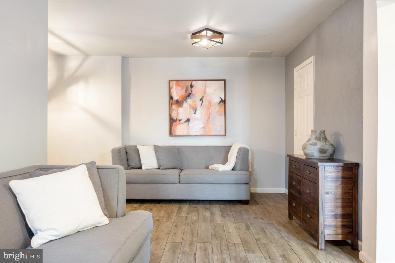 47799 Scotsborough Square Sterling, VA 20165 - Photo 36 of 53 a living room with furniture and a window