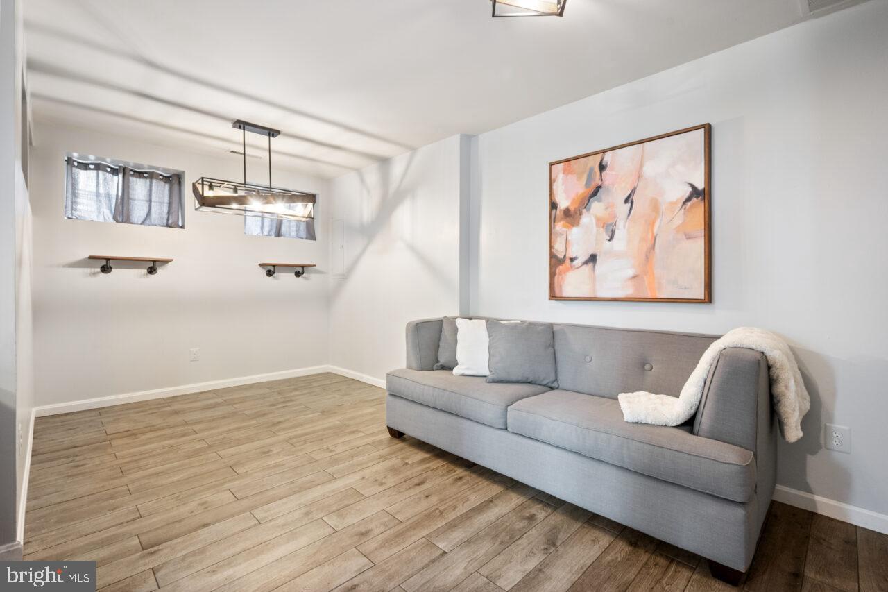 47799 Scotsborough Square Sterling, VA 20165 - Photo 37 of 53 a living room with furniture and wooden floor