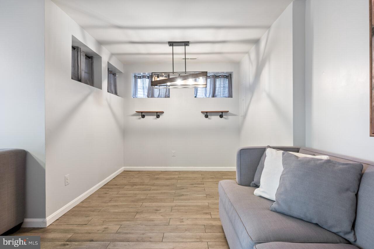 47799 Scotsborough Square Sterling, VA 20165 - Photo 39 of 53 a view of living room with furniture and chandelier