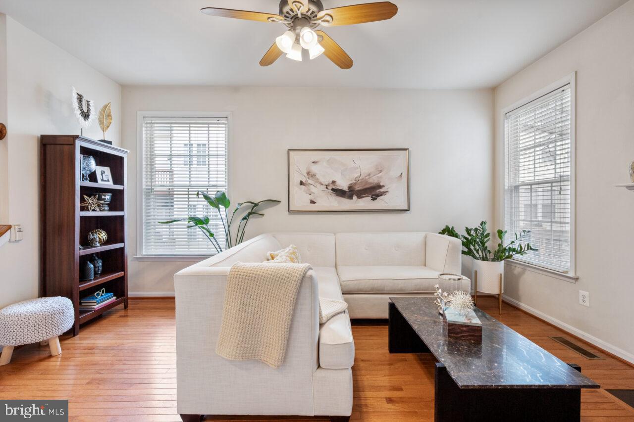 47799 Scotsborough Square Sterling, VA 20165 - Photo 10 of 53 a living room with furniture and a book shelf