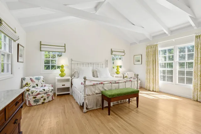 a bed room with furniture and a window