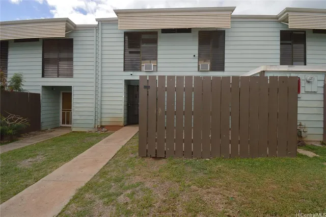 a view of a backyard of the house