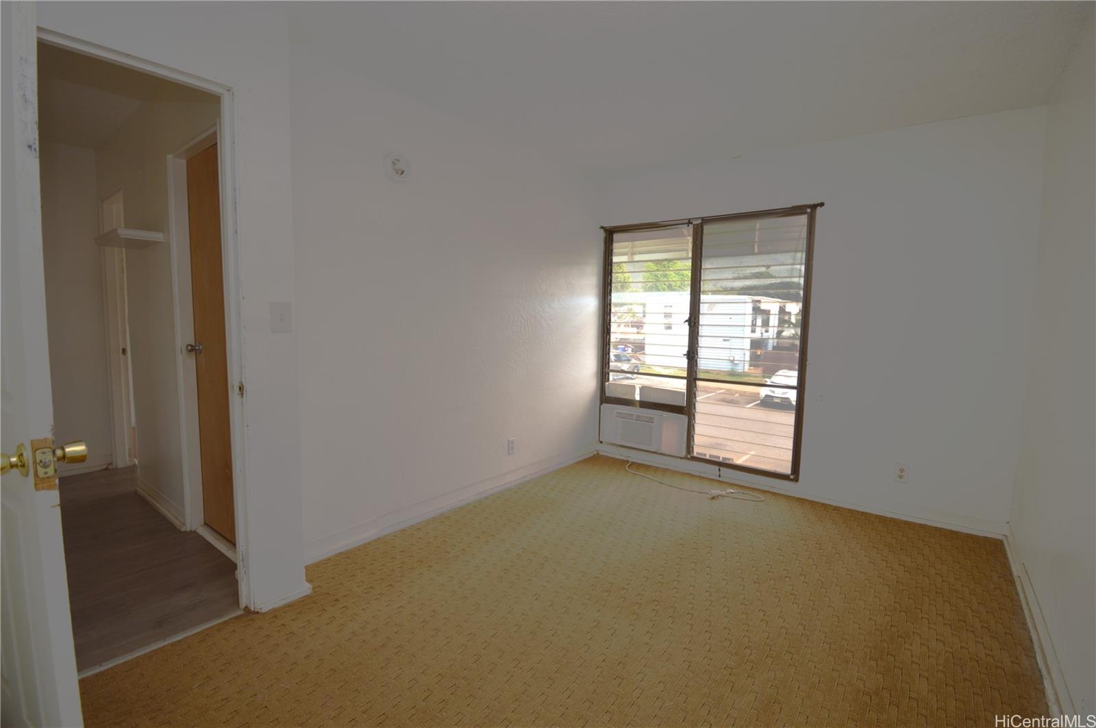 87-21317 Helelua Place, Unit 7 Waianae, HI 96792 - Photo 12 of 21 a view of an empty room with a window
