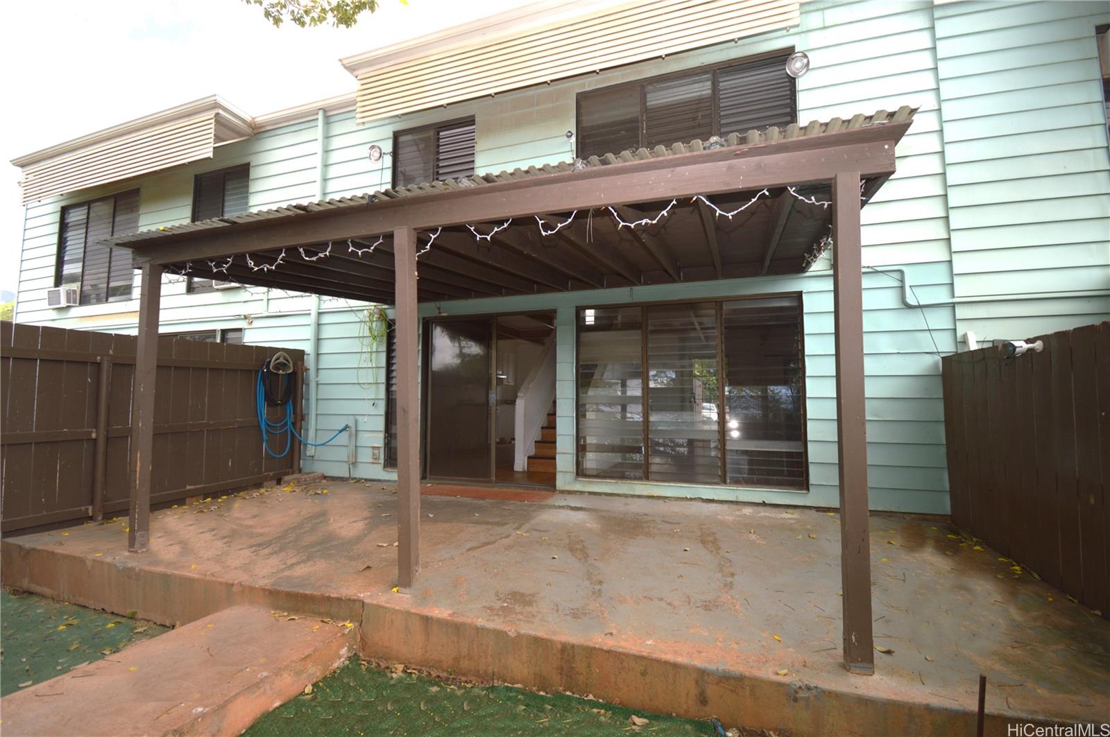 87-21317 Helelua Place, Unit 7 Waianae, HI 96792 - Photo 6 of 21 a view of a house with a garage