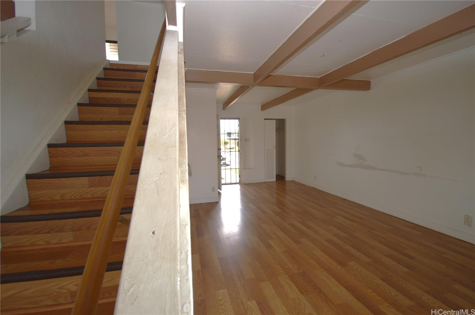 87-21317 Helelua Place, Unit 7 Waianae, HI 96792 - Photo 8 of 21 a view of an entryway with wooden floor