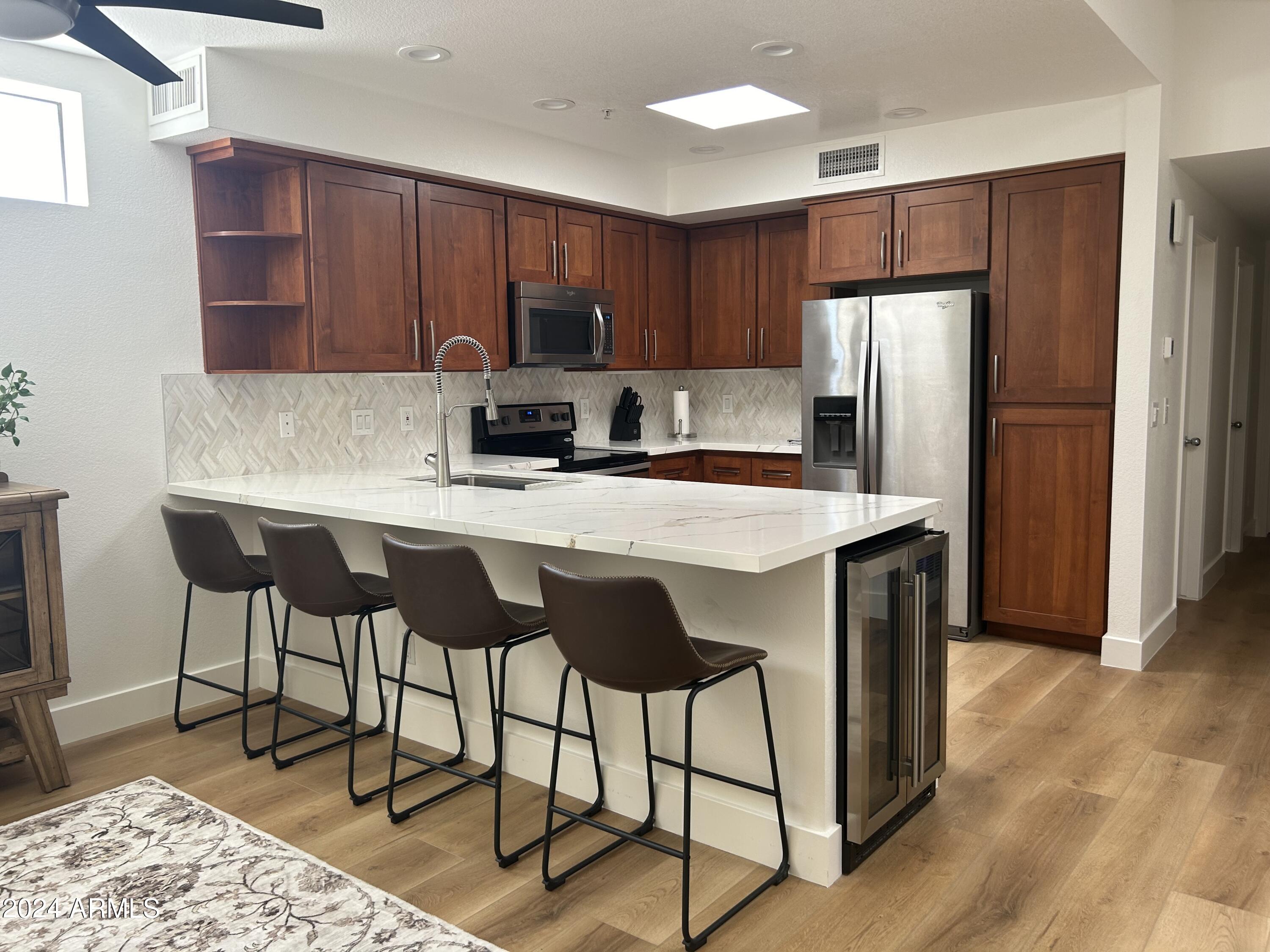 7222 East Gainey Ranch Road, Unit 232 Scottsdale, AZ 85258 - Photo 14 of 40 BEAUTIFUL QUARTZ IN KITCHEN