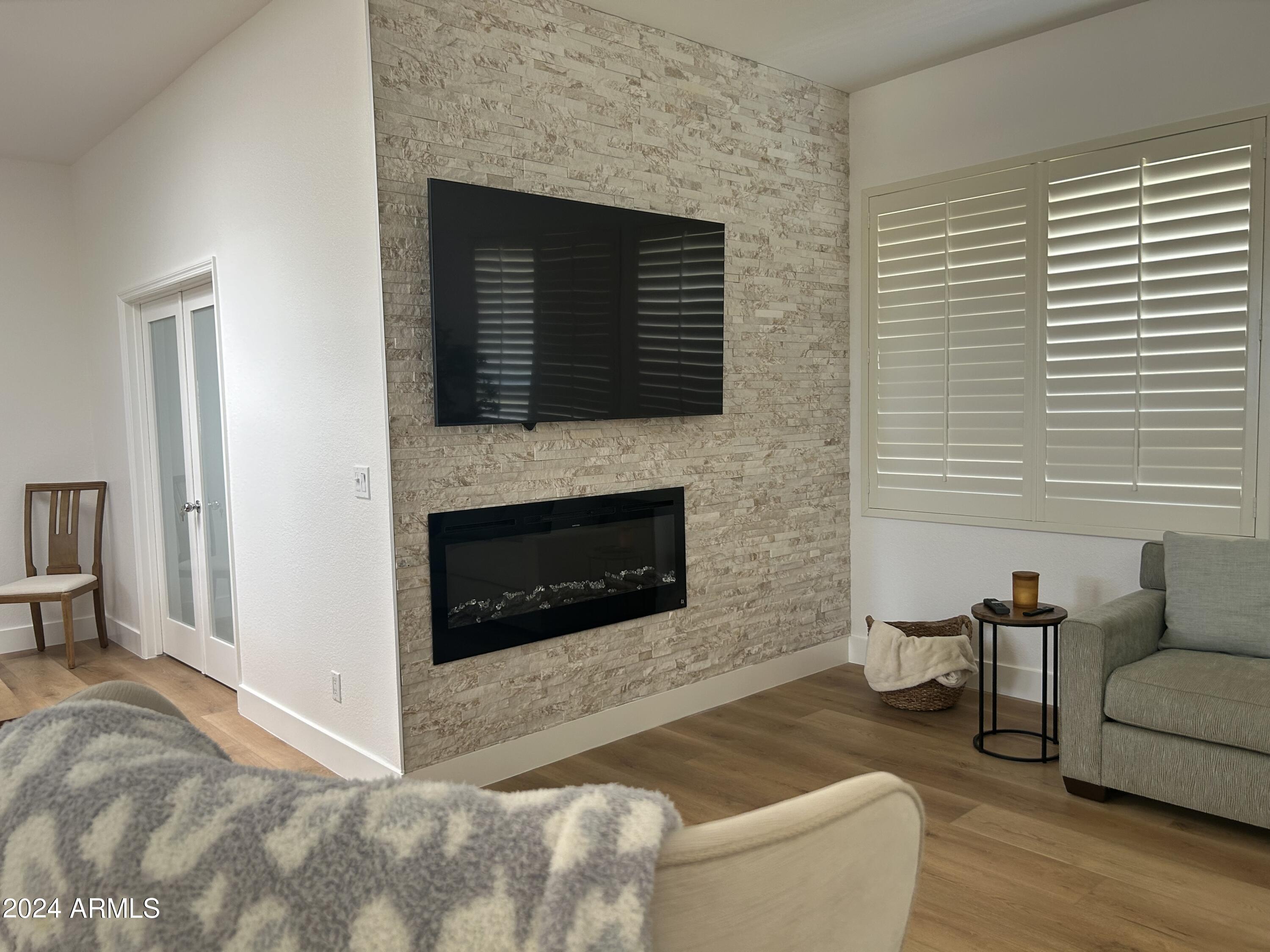 7222 East Gainey Ranch Road, Unit 232 Scottsdale, AZ 85258 - Photo 8 of 40 STONE SURROUND FIREPLACE