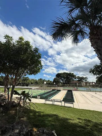 a view of a garden and basketball court