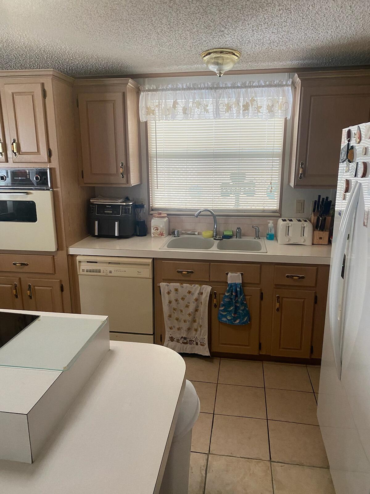 2709 Southwest Olds Place Stuart, FL 34997 - Photo 8 of 16 kitchen view 2