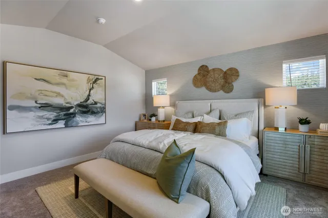 a bedroom with a bed and lamp with window