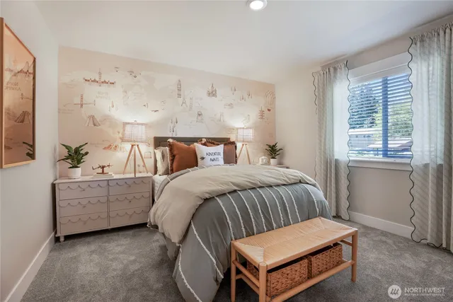 a bedroom with a bed and window