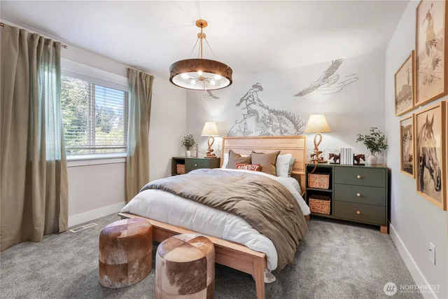 a bedroom with a bed and a chandelier