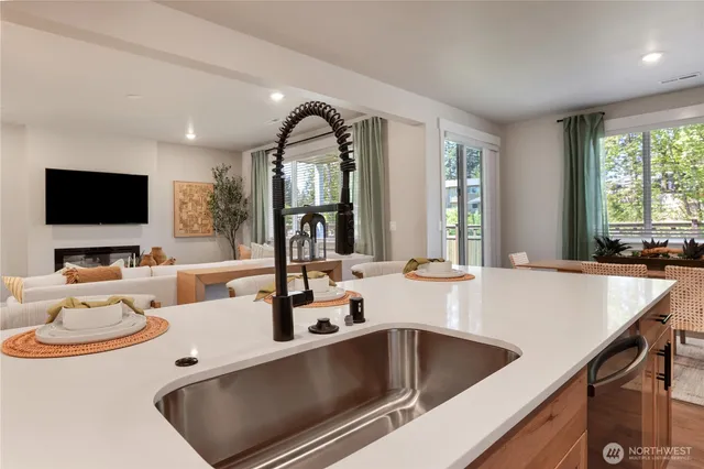 a kitchen with a sink and a refrigerator