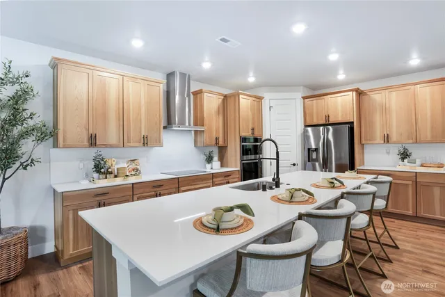 a kitchen with a table and chairs in it