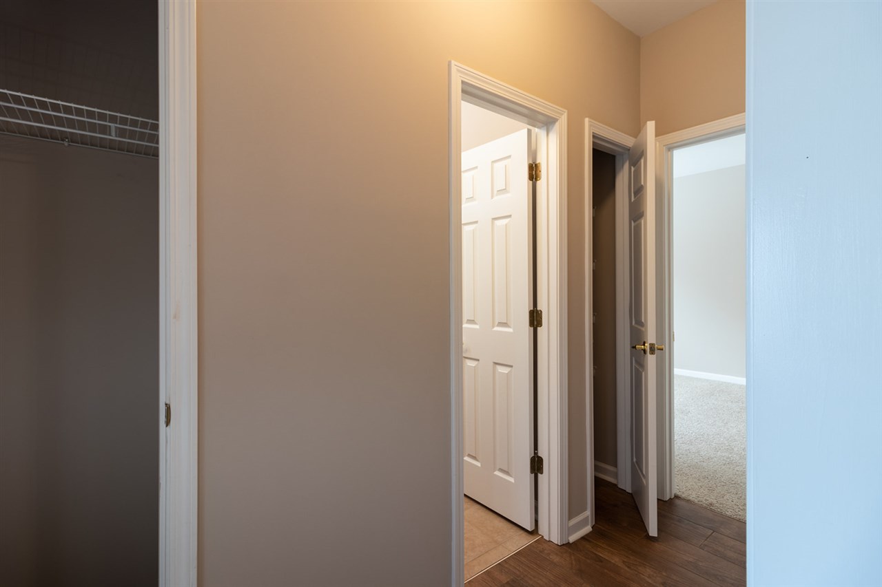 6883 Crimson Ridge Street Gulf Shores, AL 36542 - Photo 19 of 23 Hallway with 2 Closets
