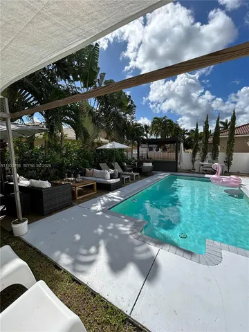 a view of a swimming pool with a patio
