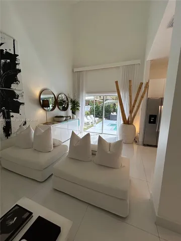 a living room with furniture and a gate