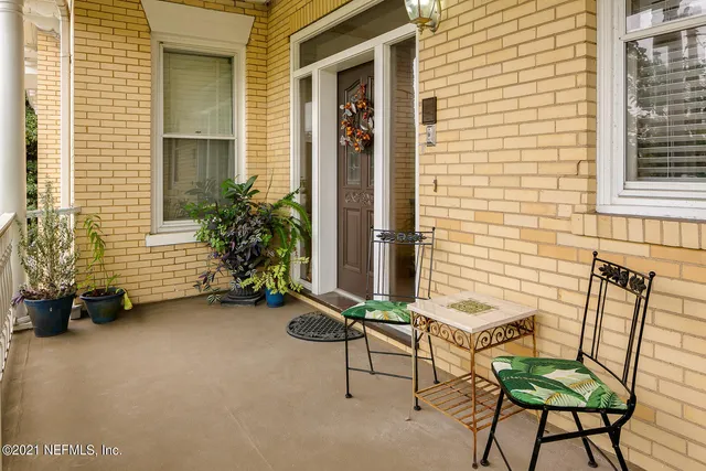 a view of two chairs in the balcony