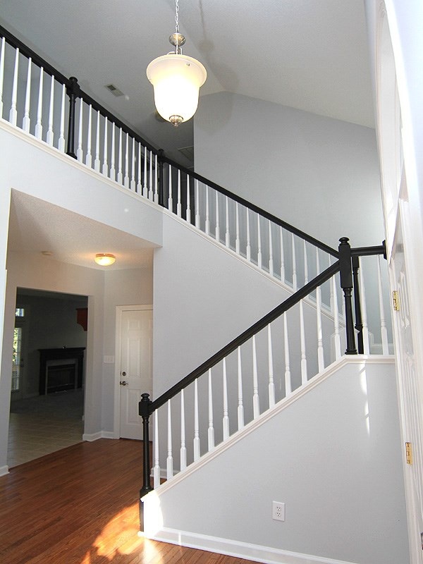 9021 Breeland Way Raleigh, NC 27613 - Photo 2 of 20 Upon entering the front door you are instantly impressed by high ceiling extending to the second floor by way of this gorgeous stairway! Curved Stairway