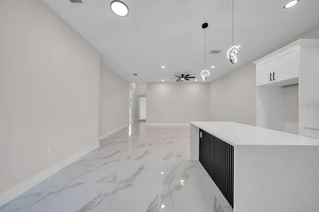 a bathroom with a sink a vanity and a shower