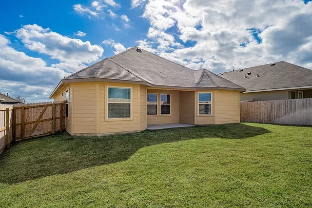 a view of a backyard of the house
