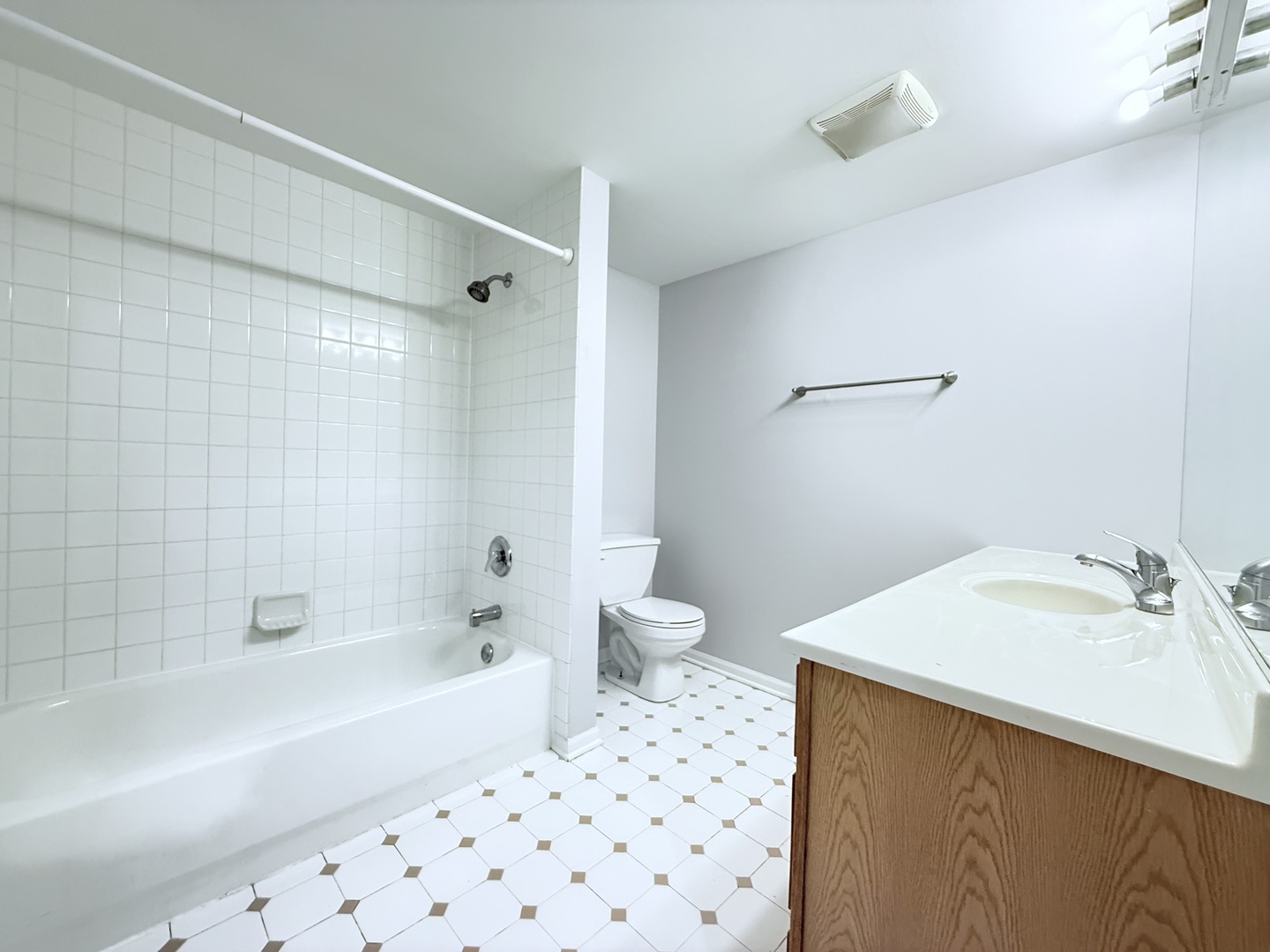 218 East Bailey Road, Unit M Naperville, IL 60565 - Photo 12 of 16 a bathroom with a sink a toilet and shower