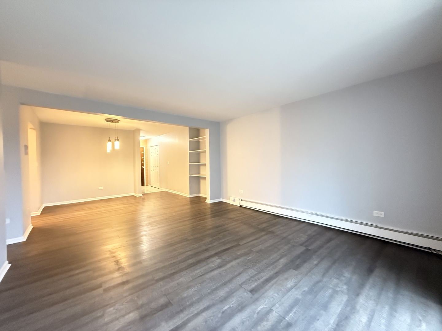 218 East Bailey Road, Unit M Naperville, IL 60565 - Photo 5 of 16 a view of an empty room with wooden floor and a window