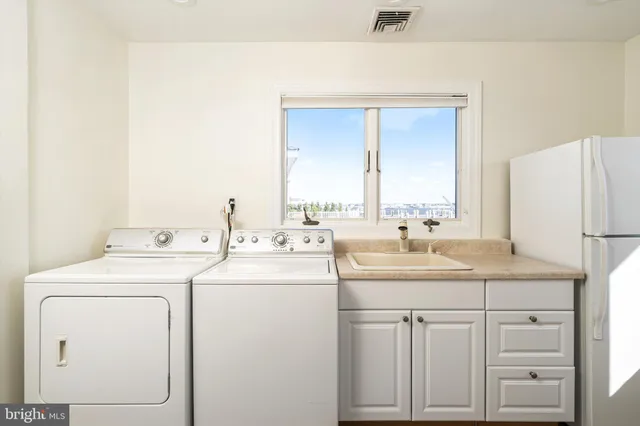 a bathroom with a sink and a large mirror