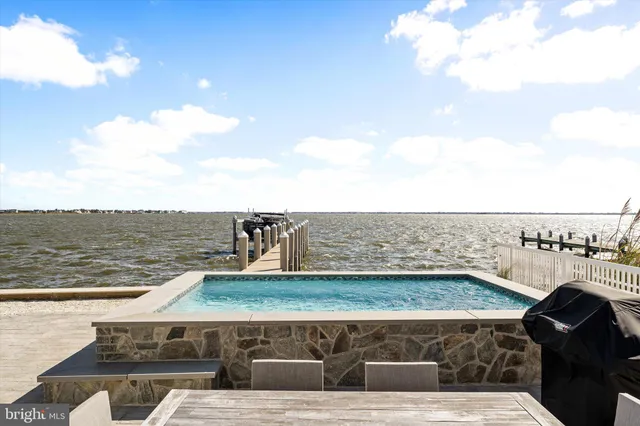 a view of a lake with a yard