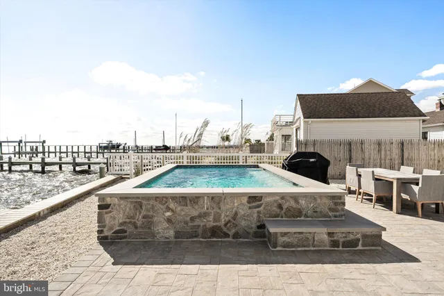 a building outdoor space with patio furniture and potted plants