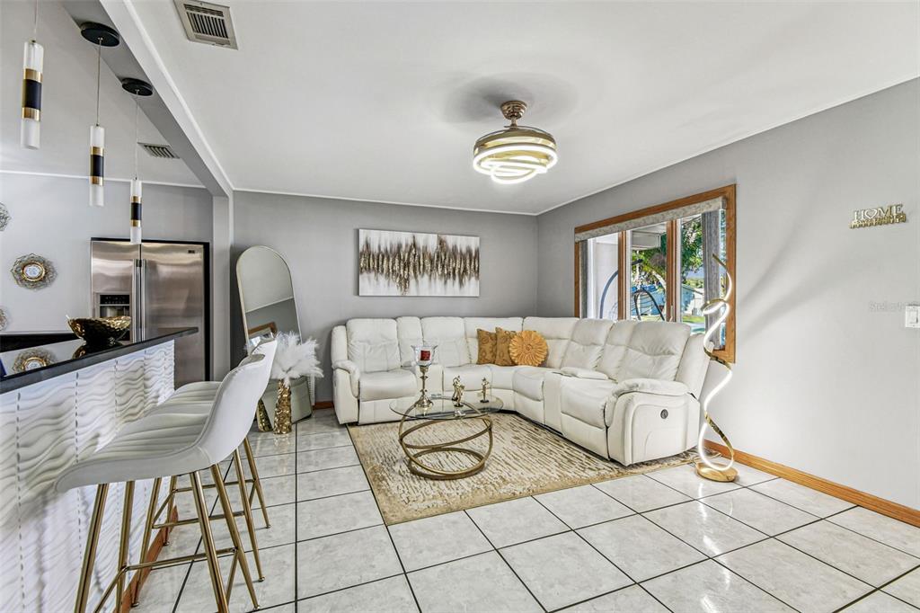 226 Maple Avenue Palm Harbor, FL 34684 - Photo 12 of 79 a living room with furniture