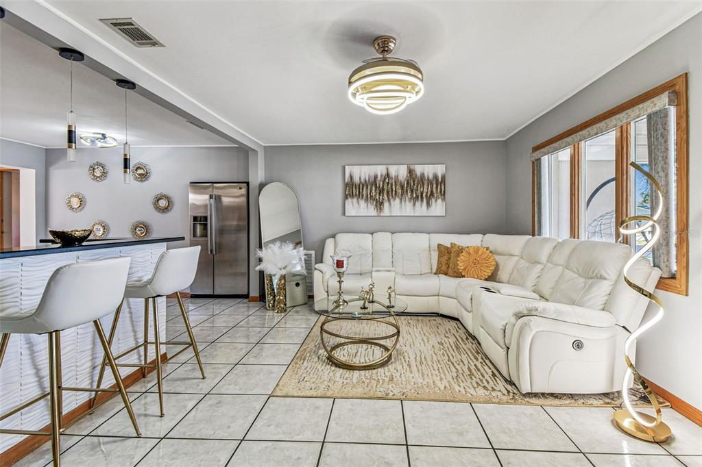 226 Maple Avenue Palm Harbor, FL 34684 - Photo 13 of 79 a living room with furniture and a window