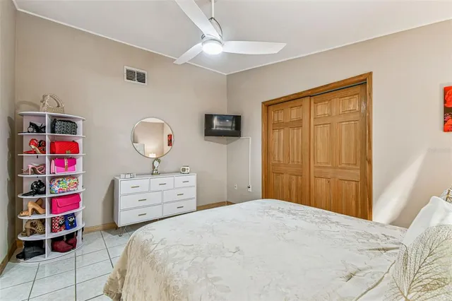 a view of a patio with table and chairs and potted plants