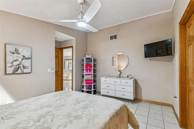 a view of balcony with two chairs and a potted plant